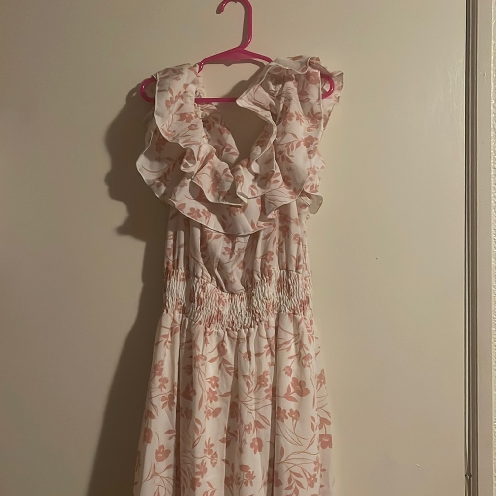 Size M. This dress color is white with pink flowers. It is off shoulder.